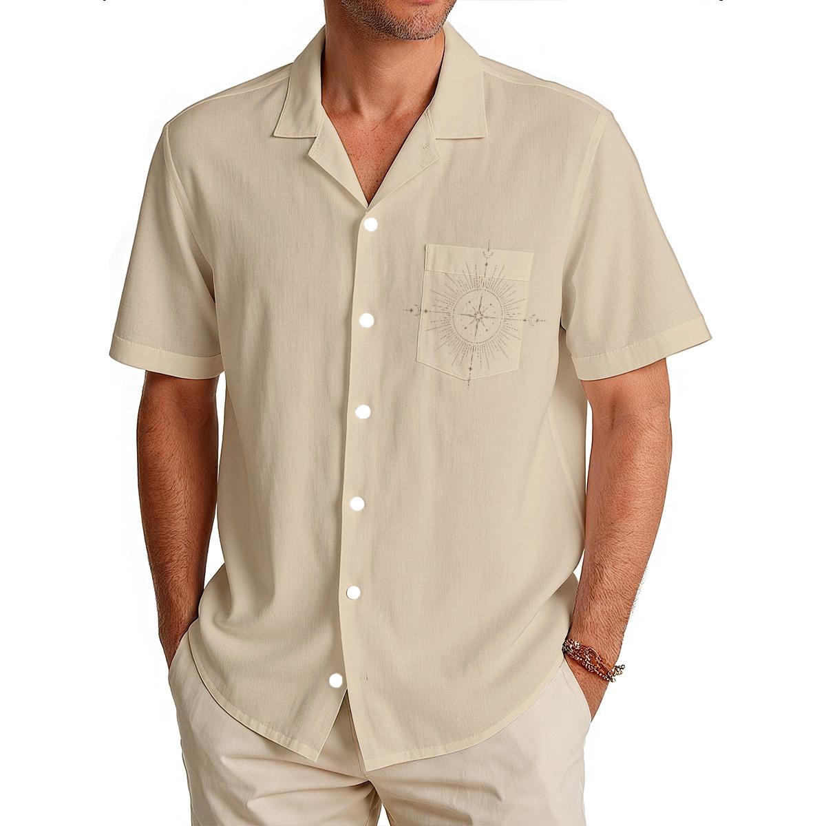 Men’s cream short-sleeve resort shirt with button front and solar compass artwork on the chest pocket