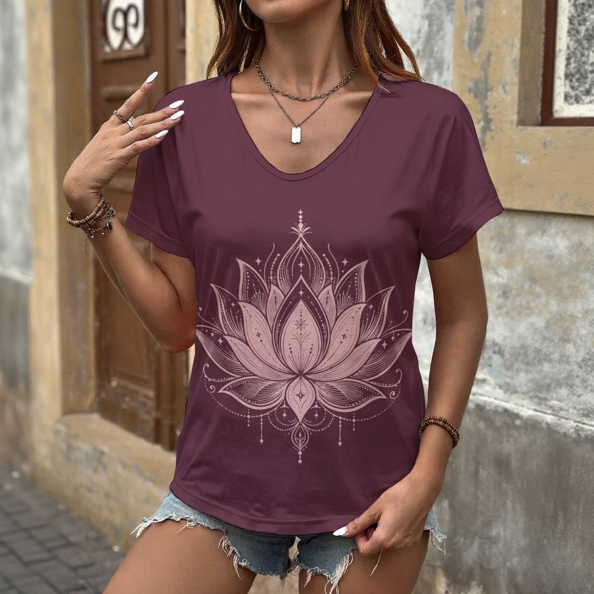 Front view of a plum V-neck tee with a large lotus graphic