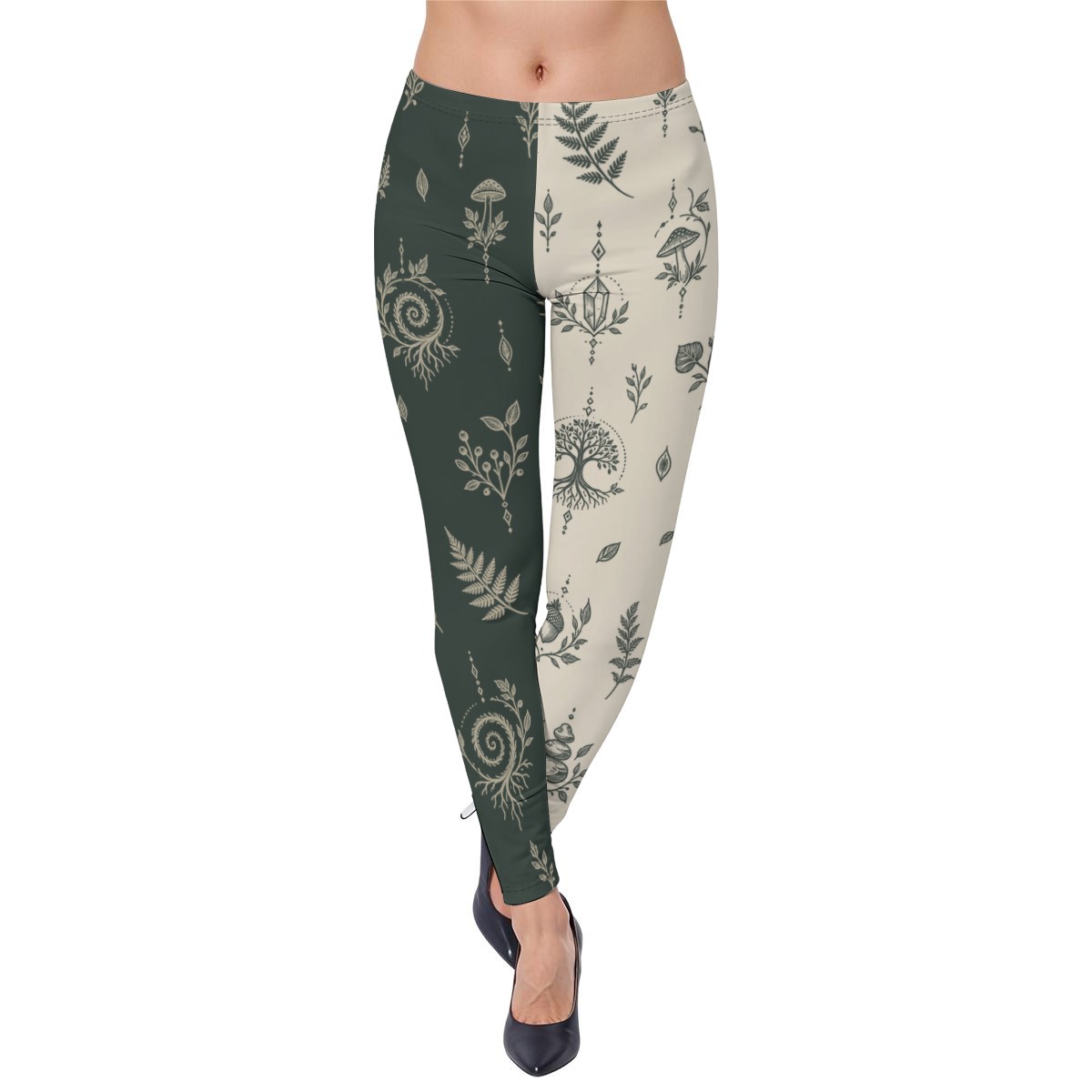 Front view of dual-tone leggings with dark green left leg, cream right leg, and botanical mystical illustrations