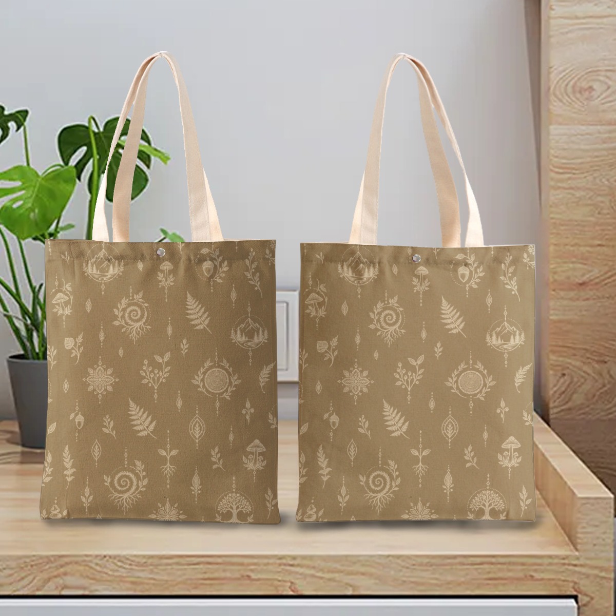 Earthbound Compass tote bag shown front and back with beige botanical and forest motif print